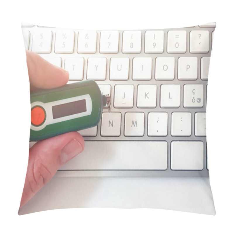 Personality  Male Hand Holding A Bank Code Generator On A White Computer Keyboard. Online Security Concept. Home Banking Pillow Covers