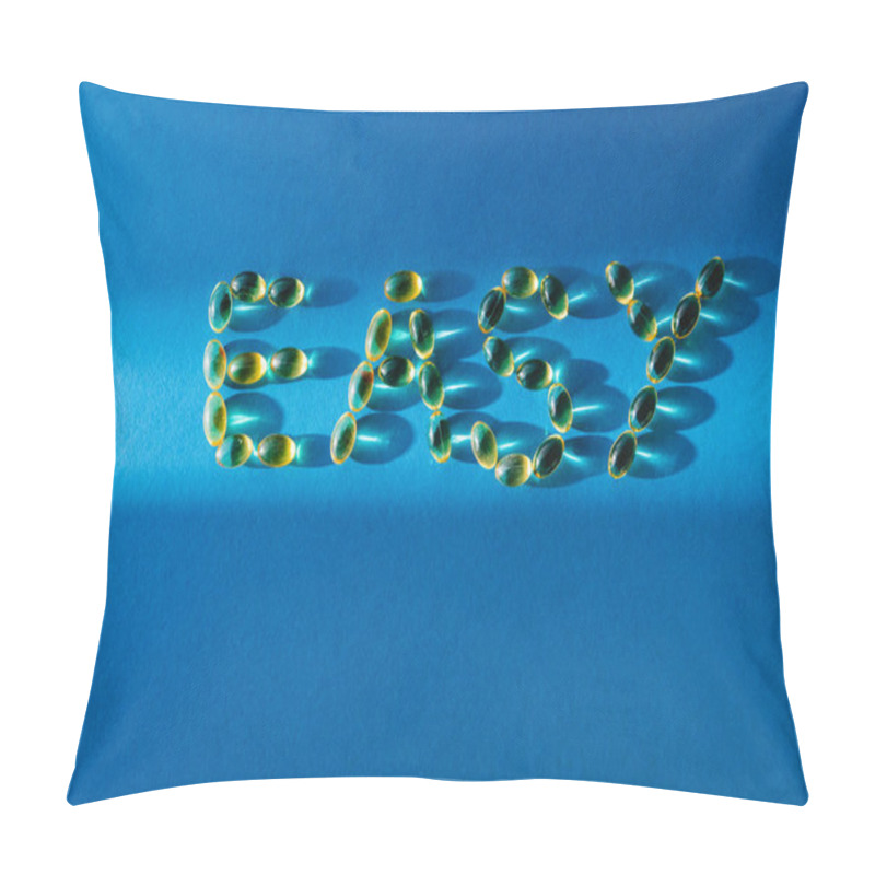 Personality  Top View Of Lettering Easy By Pills On Blue Background With Sunlight  Pillow Covers