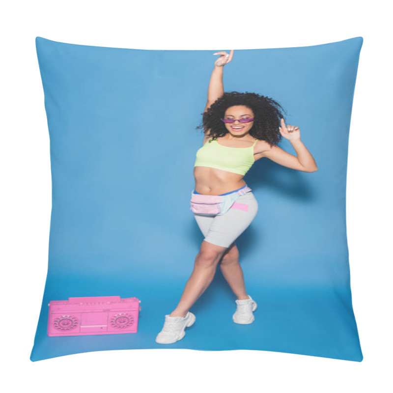 Personality  Full Length Of Smiling African American Woman In Sunglasses And Waist Bag Pointing Near Pink Boombox On Blue Pillow Covers