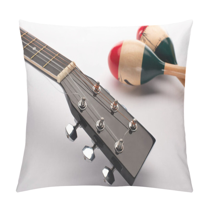 Personality  Selective Focus Of Acoustic Guitar Near Wooden Maracas On White Pillow Covers