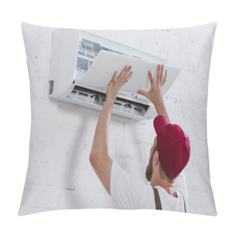 Personality  Close-up Shot Of Young Repairman Fixing Air Conditioner Hanging On White Brick Wall Pillow Covers