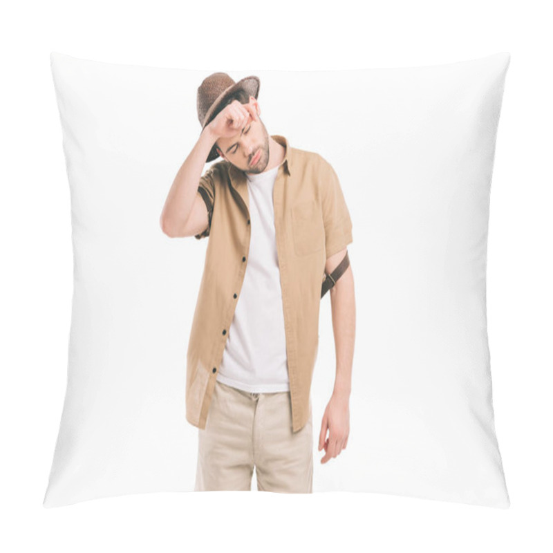 Personality  Tired Young Traveler In Hat Wiping Sweat Isolated On White Pillow Covers