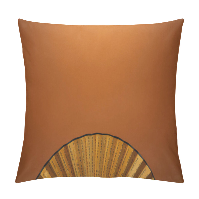 Personality  Top View Of Traditional Golden Chinese Fan With Hieroglyphs On Brown Background Pillow Covers