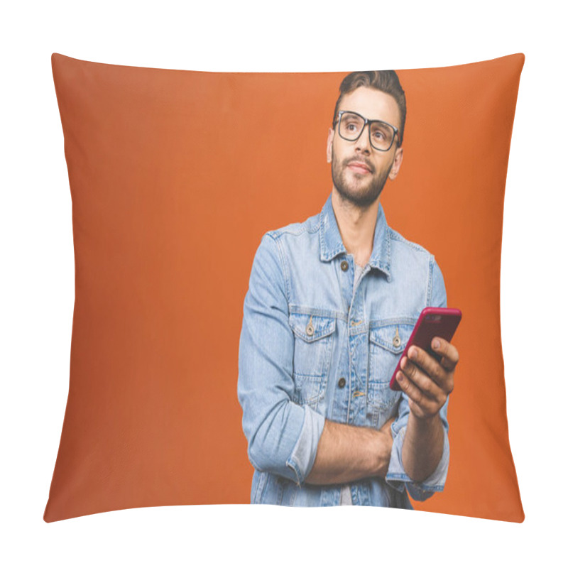 Personality  Great News! Happy Young Man In Glasses Typing Sms Isolated Against Orange Background. Pillow Covers