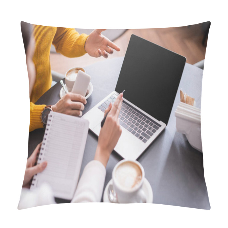 Personality  Man With Smartphone Pointing At Laptop Wit Blank Screen Near Coffee And Friend With Notebook On Blurred Foreground In Restaurant  Pillow Covers