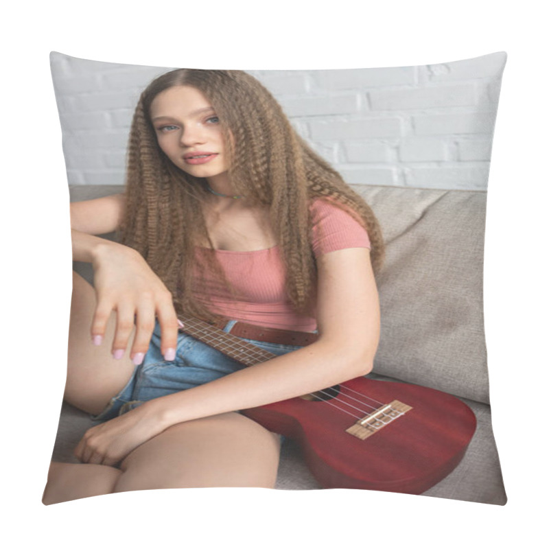 Personality  Pretty Teenage Girl In Casual Clothes Sitting On Couch Near Ukulele In Living Room  Pillow Covers