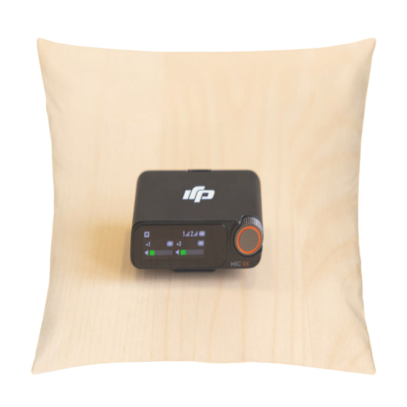 Personality  Bishkek, Kyrgyzstan - November 4, 2024: DJI MIC 2 Receiver With Display Interface Showing Audio Levels And Settings On A Wooden Surface Pillow Covers