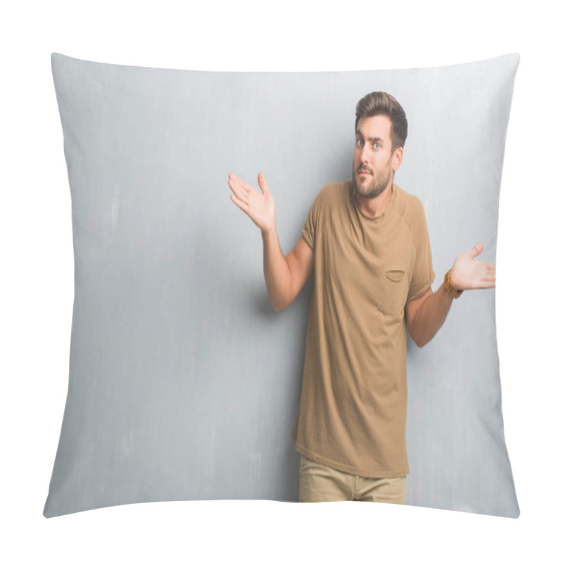 Personality  Handsome Young Man Over Grey Grunge Wall Clueless And Confused Expression With Arms And Hands Raised. Doubt Concept. Pillow Covers