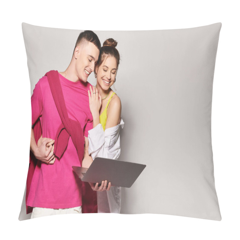 Personality  A Stylish Young Couple Stands With Laptop Side By Side In A Studio With A Grey Background. Pillow Covers