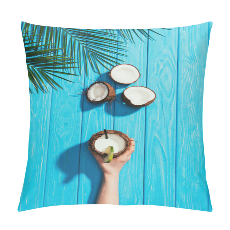 Personality  Top View Of Human Hand With Coconut Cocktail, Cracked Coconuts And Palm Leaves On Turquoise Wooden Surface Pillow Covers