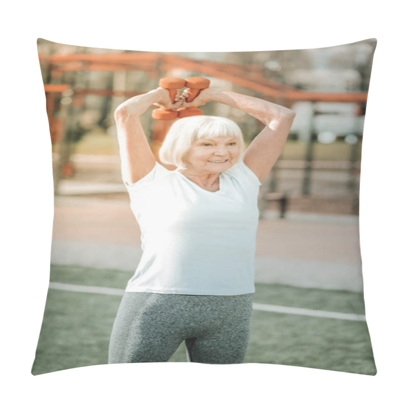 Personality  Sport With Weights. Hoary Energetic Sportswoman In Gym Clothing Engaging In Arms Exercises With Weights Pillow Covers