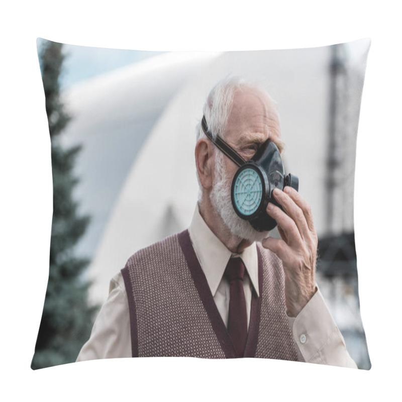 Personality  PRIPYAT, UKRAINE - AUGUST 15, 2019: Senior Man Touching Protective Mask Near Abandoned Chernobyl Reactor  Pillow Covers