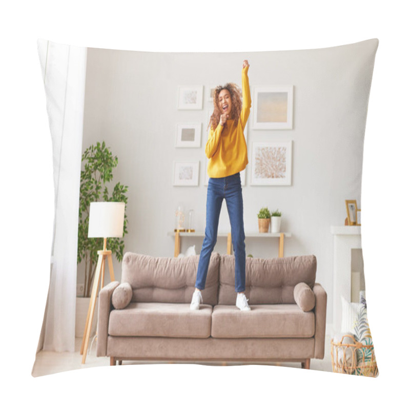 Personality  Pretending To Be Famous Singer. Overjoyed Afro American Teenage Girl In Casual Wear Singing And Dancing On Sofa In Modern Living Room At Home. Young Happy Female Enjoying Carefree And Leisure Weekend Pillow Covers