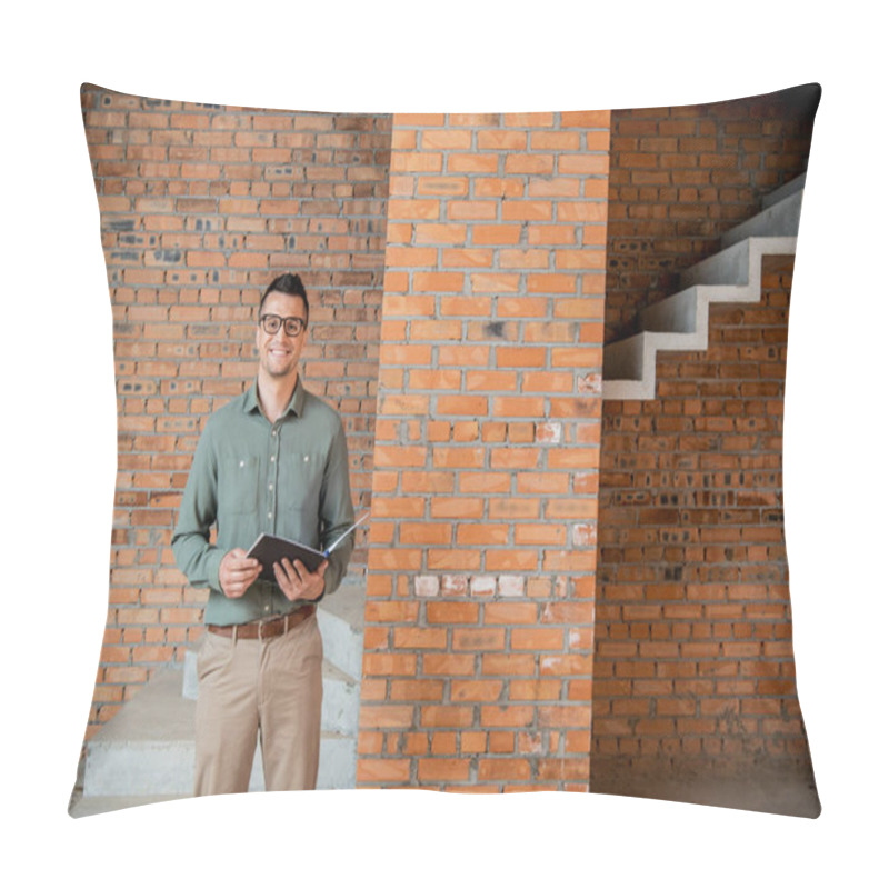 Personality  Joyful Real Estate Agent In Eyeglasses Looking At Camera In House With Unfinished Interior Pillow Covers