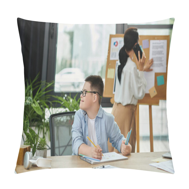 Personality  A Young Boy With Down Syndrome Sits At A Desk In An Office Setting, Working On A Project While His Mother Works Nearby. Pillow Covers