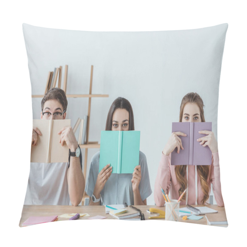 Personality  Three Young Students Holding Books While Sitting At Table  Pillow Covers