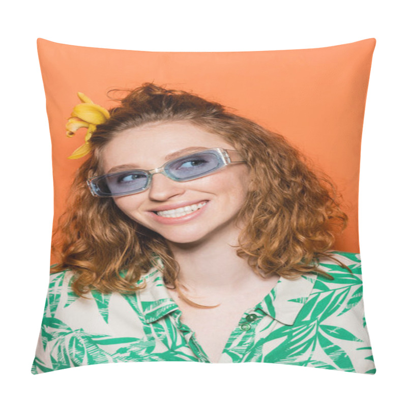 Personality  Portrait Of Joyful Young Redhead Woman With Orchid Flower In Hair And Blue Sunglasses Looking Away And Standing On Orange Background, Summer Casual And Fashion Concept  Pillow Covers