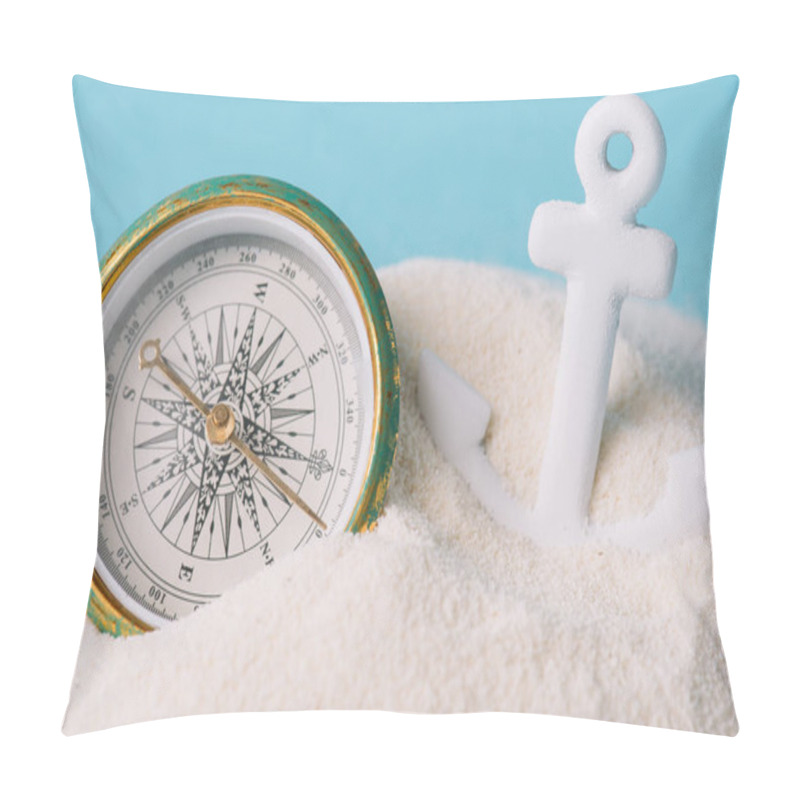 Personality  Plastic Anchor And Compass In White Sand Isolated On Blue Pillow Covers