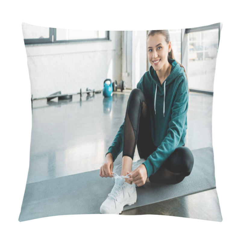 Personality  Smiling Sportswoman Tying Laces On Training Shoes While Sitting On Fitness Mat At Gym Pillow Covers