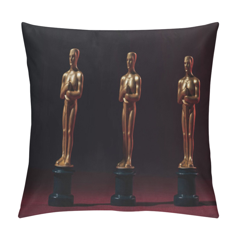 Personality  KYIV, UKRAINE - JANUARY 10, 2019: Row Of Golden Oscar Awards On Black Background Pillow Covers