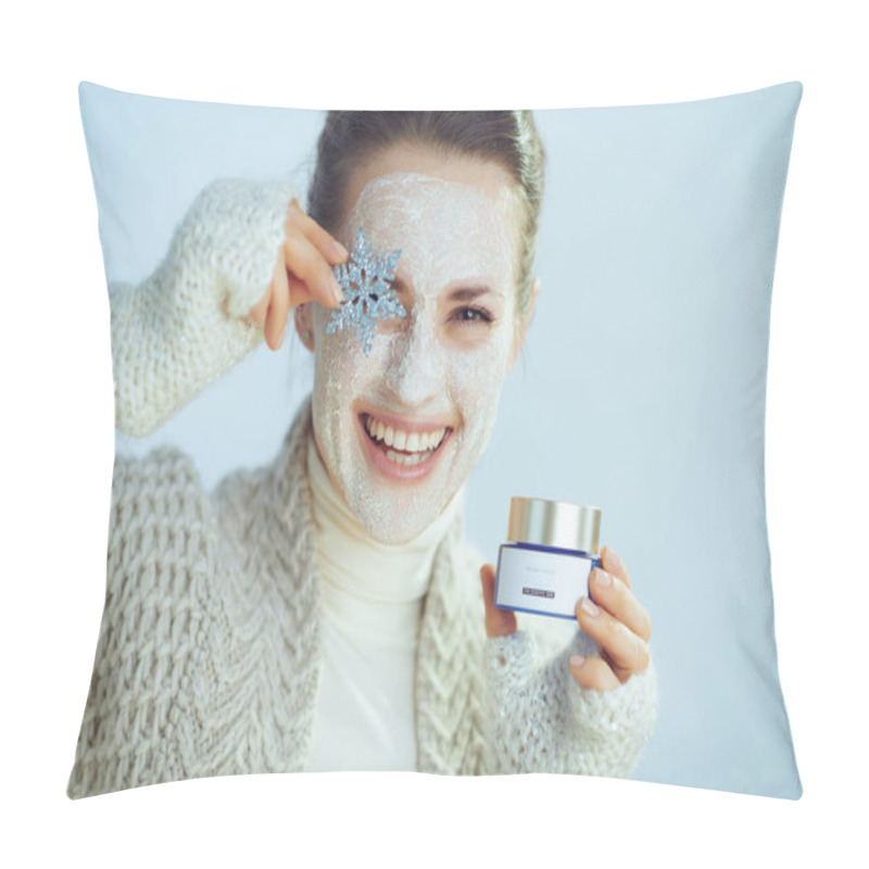 Personality  Smiling Stylish 40 Years Old Housewife In Roll Neck Sweater And Cardigan With White Facial Mask Holding Snowflake And Cosmetic Jar Isolated On Winter Light Blue Background. Pillow Covers