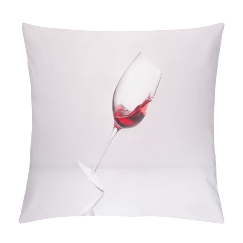 Personality  Inclined Glass With Splashing Red Wine On Reflective Surface And On White Pillow Covers