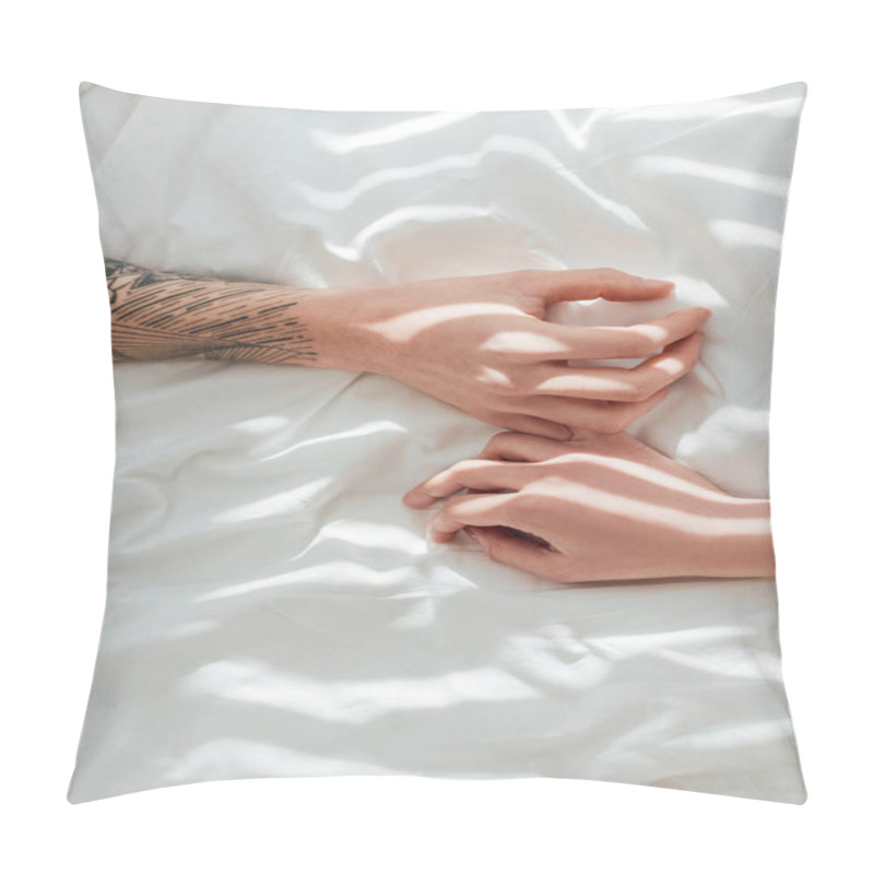 Personality  Cropped Shot Of Loving Couple Lying On White Bed Sheet Together Pillow Covers