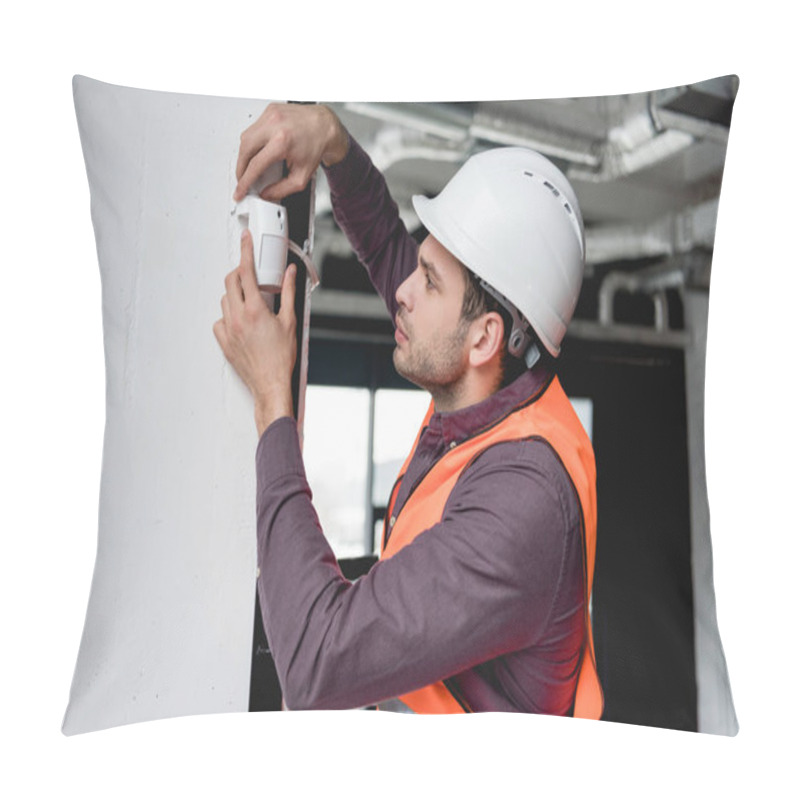 Personality  Serious Firefighter In Uniform And Helmet Checking Fire Alarm  Pillow Covers