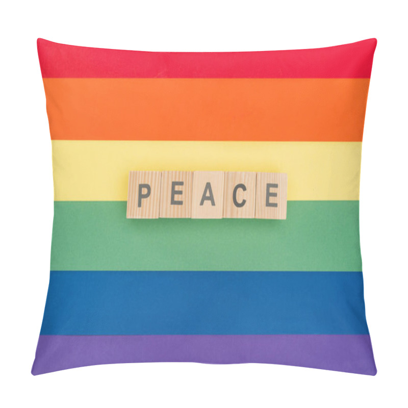 Personality  Top View Of Pease Lettering Peace Made Of Wooden Cubes On Paper Rainbow Background Pillow Covers