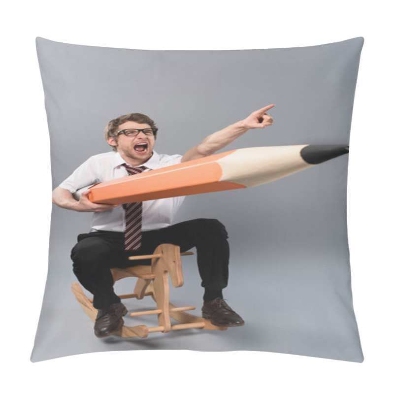 Personality  Funny Businessman In Glasses Holding Huge Decorative Pencil,pointing With Finger, Screaming And Riding Wooden Rocking Horse On Grey Background Pillow Covers