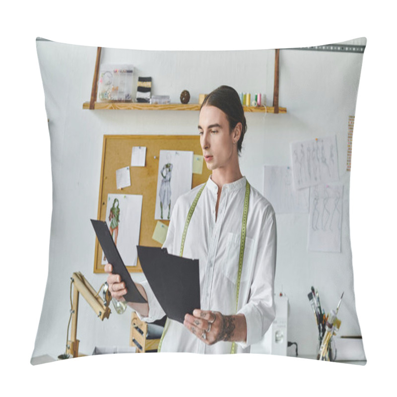 Personality  A Young, Gay Man, Owner Of A DIY Clothing Restoration Atelier, Examines A Design Sketch In His Studio. Pillow Covers