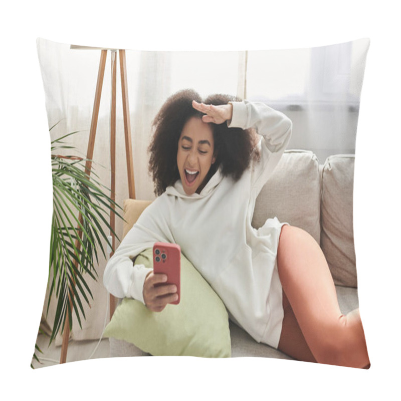 Personality  A Young Woman Relaxes On Her Couch, Playfully Interacting With Her Phone While Dressed Comfortably. Pillow Covers