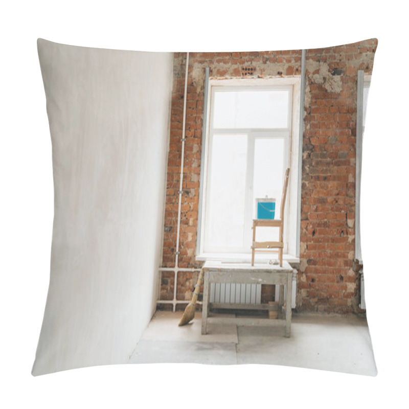 Personality  Concept Repair. Plaster Of Windows And Walls Of Red Brick. Large Windows In The Room, A Construction Goat, A Chair And A Bucket With Putty. Pillow Covers