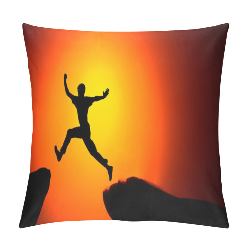 Personality  Man Jumping Across The Gap From One Rock To Cling To The Other. Man Jumping Over Rocks With Gap On Sunset Fiery Background. Element Of Design Pillow Covers