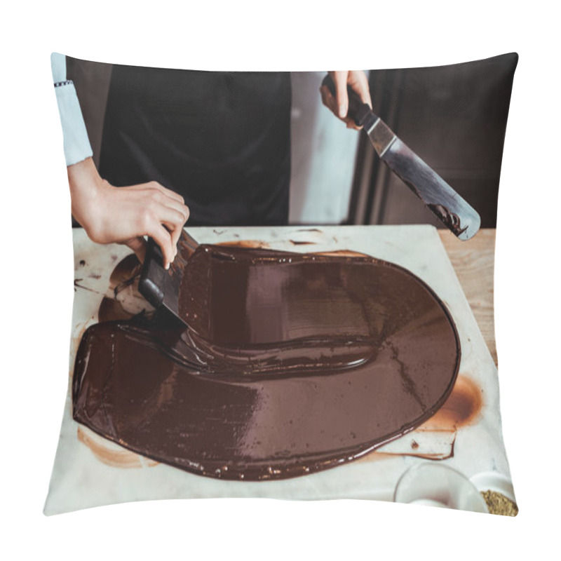 Personality  Cropped View Of Chocolatier Holding Cake Scrapers Near Melted Dark Chocolate On Marble Surface  Pillow Covers