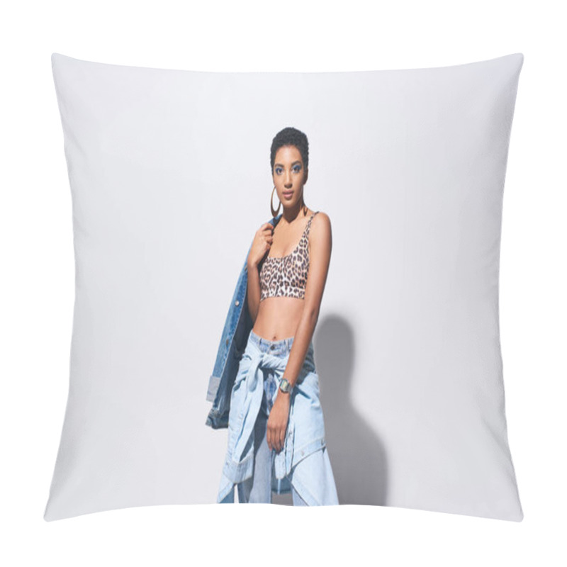 Personality  Confident Young African American Model With Short Hair And Vivid Makeup Posing In Top With Leopard Print And Denim Outfit While Standing On Grey Background, Denim Fashion Concept Pillow Covers