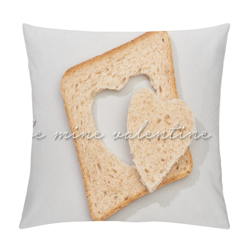 Personality  Top view of slice of bread with carved heart and be mine valentine lettering on grey background pillow covers