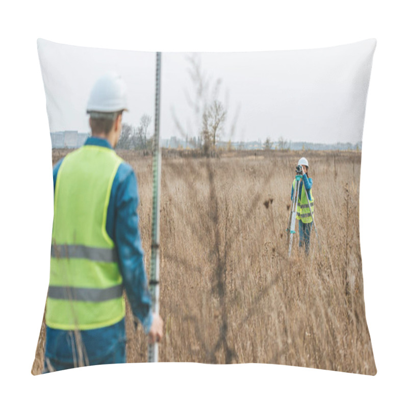 Personality  Selective Focus Of Surveyors Measuring Land With Digital Level And Ruler In Field Pillow Covers