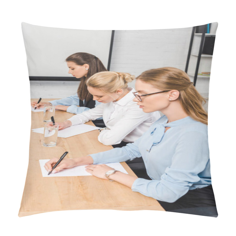 Personality  Focused Young Businesswomen Sitting At Conference Hall And Writing Documents Pillow Covers