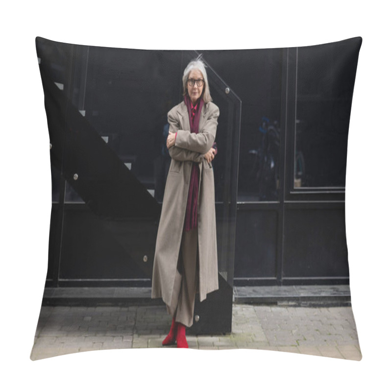 Personality  An Elderly Woman With A Sense Of Style Poses Elegantly On A City Sidewalk. She Wears A Long Coat And Striking Red Boots, Exuding Confidence And Grace In An Urban Setting. Pillow Covers