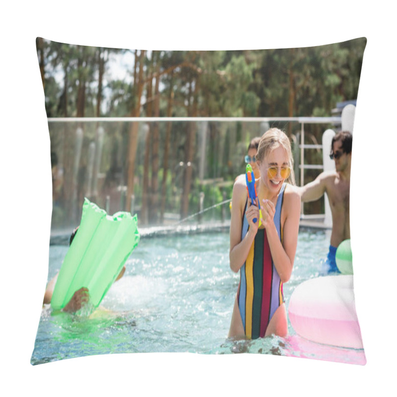 Personality  Cheerful Woman In Striped Swimsuit Holding Water Pistol Near Friends In Pool Pillow Covers