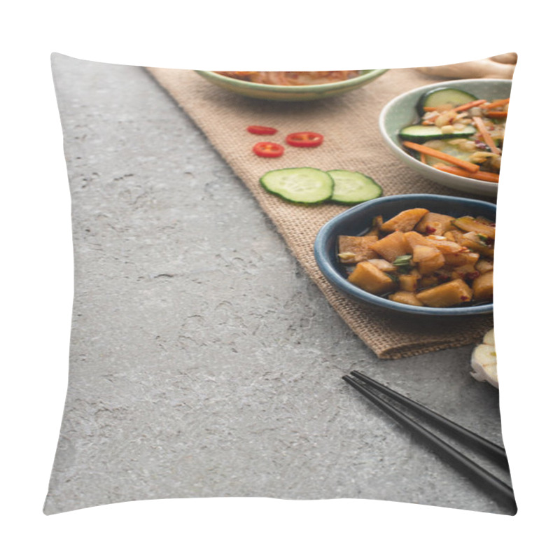 Personality  Selective Focus Of Bowls With Kimchi Near Ginger, Sliced Cucumber And Chili Pepper On Sackcloth Near Chopsticks On Concrete Surface Pillow Covers