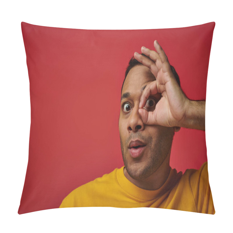 Personality  Amazed Indian Man In Yellow T-shirt Showing Okay Sign, Hand Near Face Background In Studio Pillow Covers