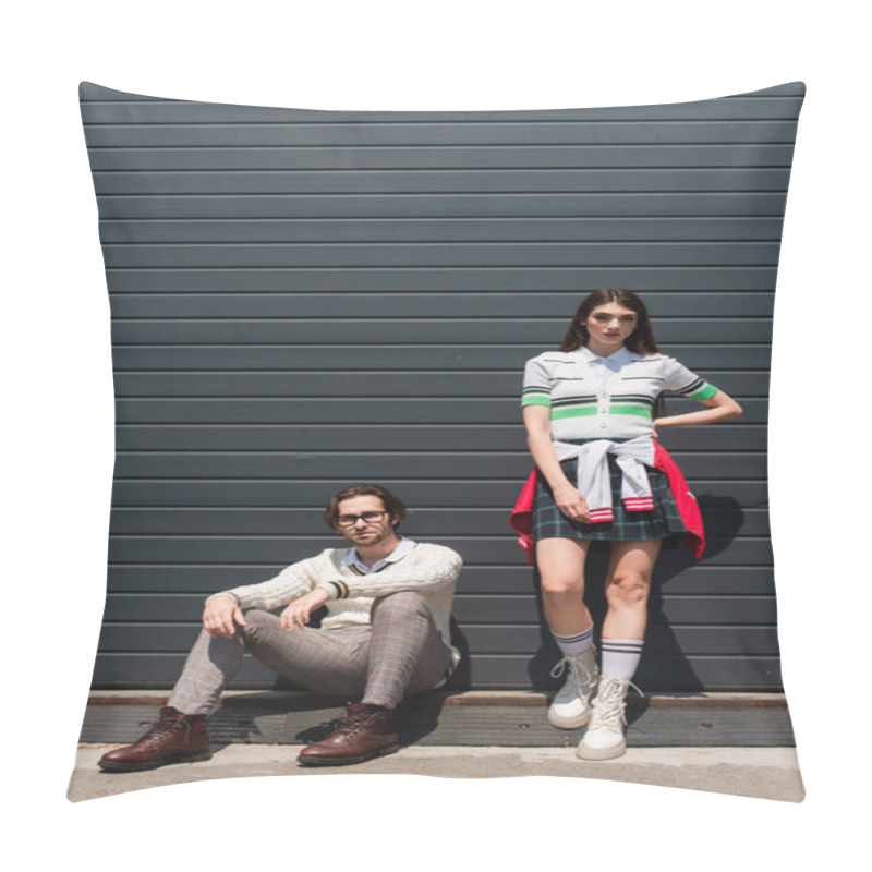 Personality  Stylish Woman Standing With Hand On Hip Near Man Sitting On Border Of Urban Street Pillow Covers