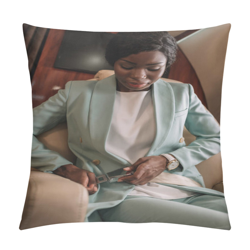 Personality  Attractive African American Businesswoman Fastening Safety Belt In Private Jet Pillow Covers