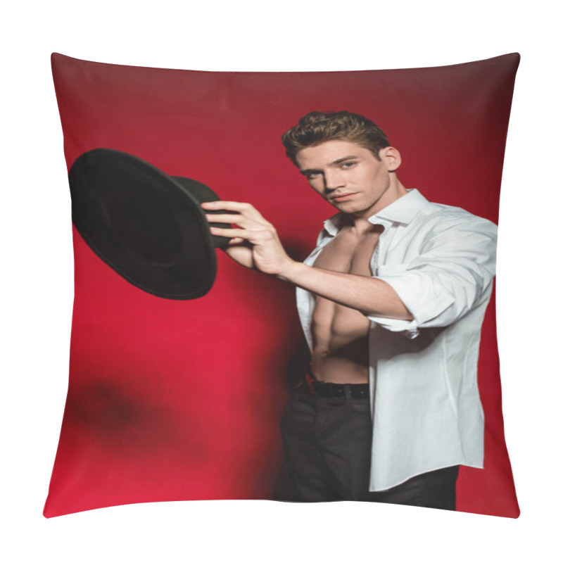 Personality  Sexy Young Elegant Man In Unbuttoned Shirt With Muscular Bare Torso Holding Hat On Red Background Pillow Covers