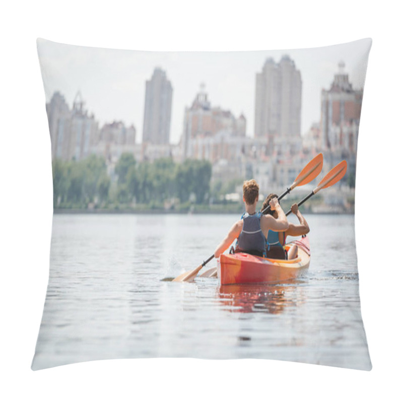 Personality  Back View Of Active Multiethnic Couple In Life Vests Paddling In Sportive Kayak On Calm Water Surface On Summer Day With View Of Blurred Urban Buildings On Riverside  Pillow Covers