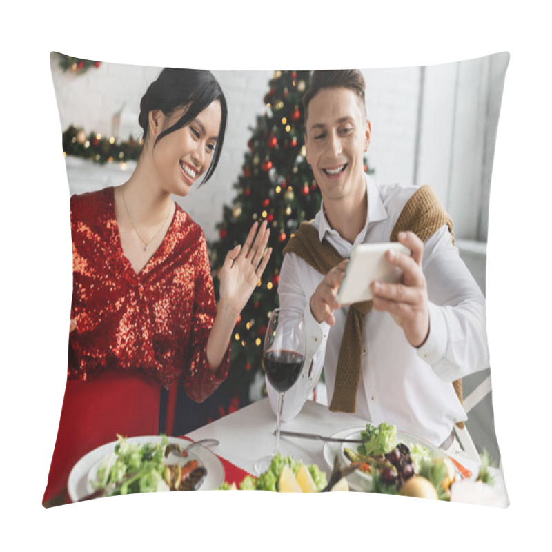 Personality  Smiling Man Holding Smartphone Near Pregnant Asian Wife Waving Hand During Video Call During Festive Supper Pillow Covers