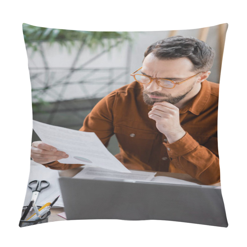 Personality  Deep In Thought Bearded Businessman In Eyeglasses And Shirt Looking At Document Next To Laptop, Scissors And Pen Holder With Pens On Work Desk In Office Pillow Covers