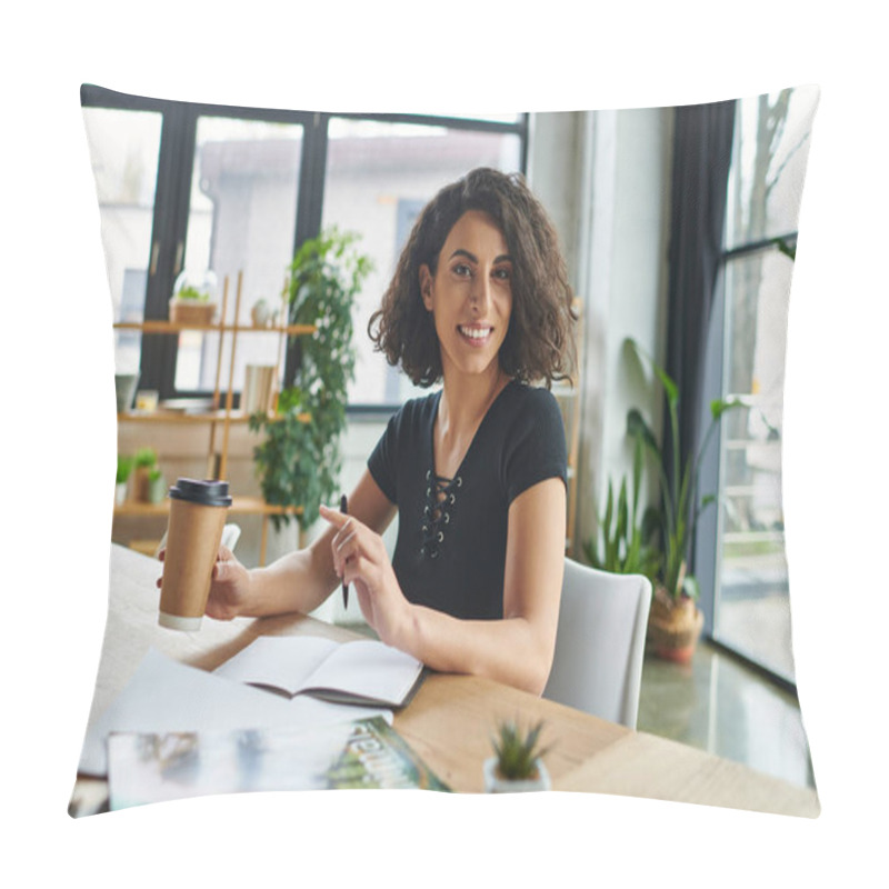 Personality  Optimistic Multiracial Motivation Coach Holding Takeaway Drink In Paper Cup And Smiling At Camera Near Notebooks And Magazines At Workplace In Interest Club, Social Activism And Dedication Concept Pillow Covers